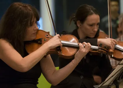 women playing violins